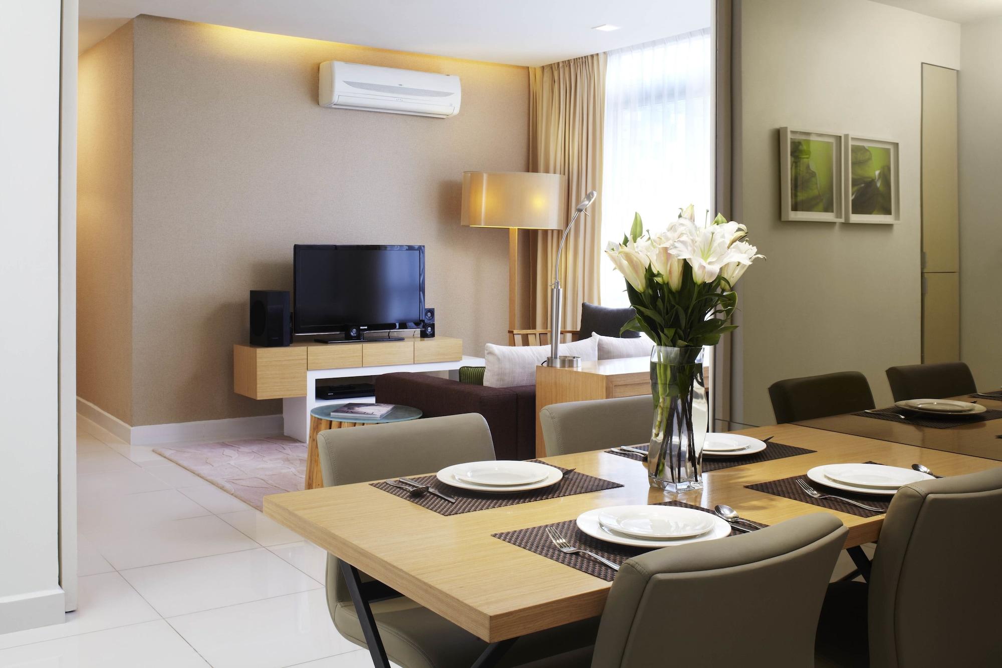 Parkroyal Serviced Suites Куала-Лумпур Екстер'єр фото A living room with a wall-mounted air conditioner